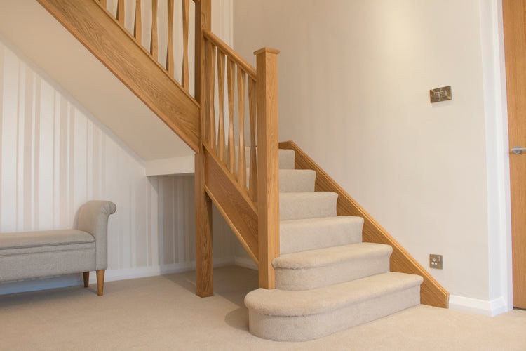 Should I choose wooden or carpeted stairs?